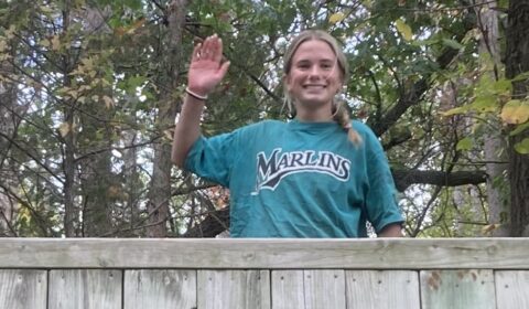 Girl waving 'hi' at the top of The Wall